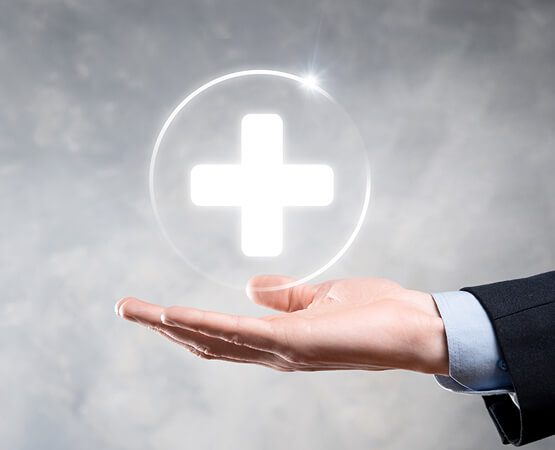 A hand holding a glowing white cross in its palm, symbolizing hope, healing, and the successful delivery of a digital marketing solution for a healthcare brand.