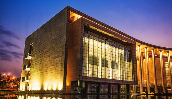 A large, modern architectural building interior with high ceilings and natural light, symbolizing the scale and professionalism of the consulting engineering industry.