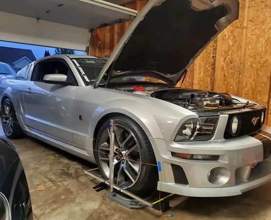 The challenge faced by QuickTrick Alignment to showcase complex portable wheel alignment kits and accessories on a functional ecommerce platform.