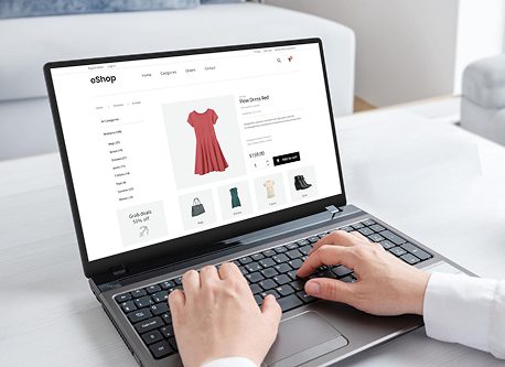 Custom ecommerce web development showing online store interface on laptop for WooCommerce and marketplace development