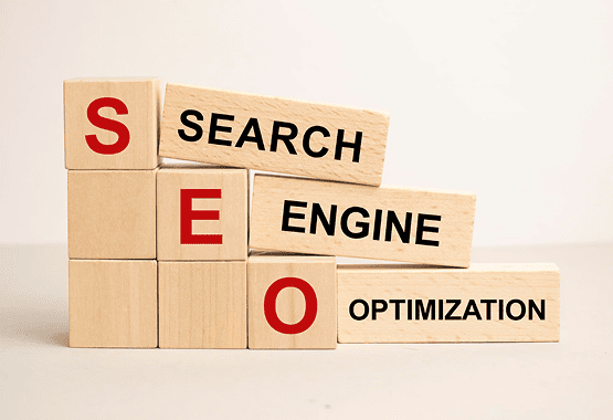 Wooden letter blocks spelling SEO with the words search, engine, and optimization on connecting tiles