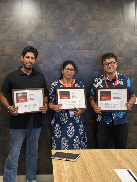 Wisitech AI Showcase 2025 winners Nidhi, Dipankar, and Nitesh.