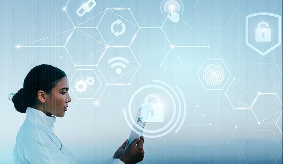 A professional woman interacting with a holographic interface displaying a digital security shield and network connections, symbolizing advanced cybersecurity solutions.